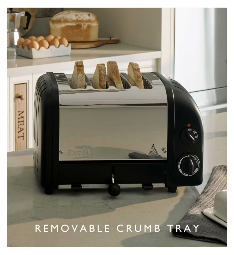 Matte black 4-slice toaster with removable crumb tray focus on front base.