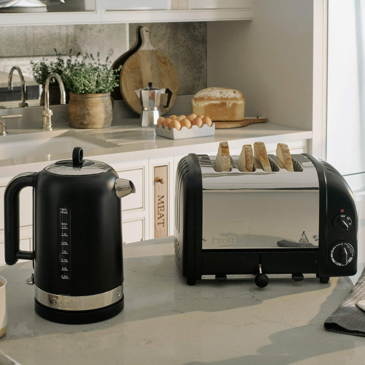 Matte black electric kettle and 4-slice toaster kitchen set on countertop