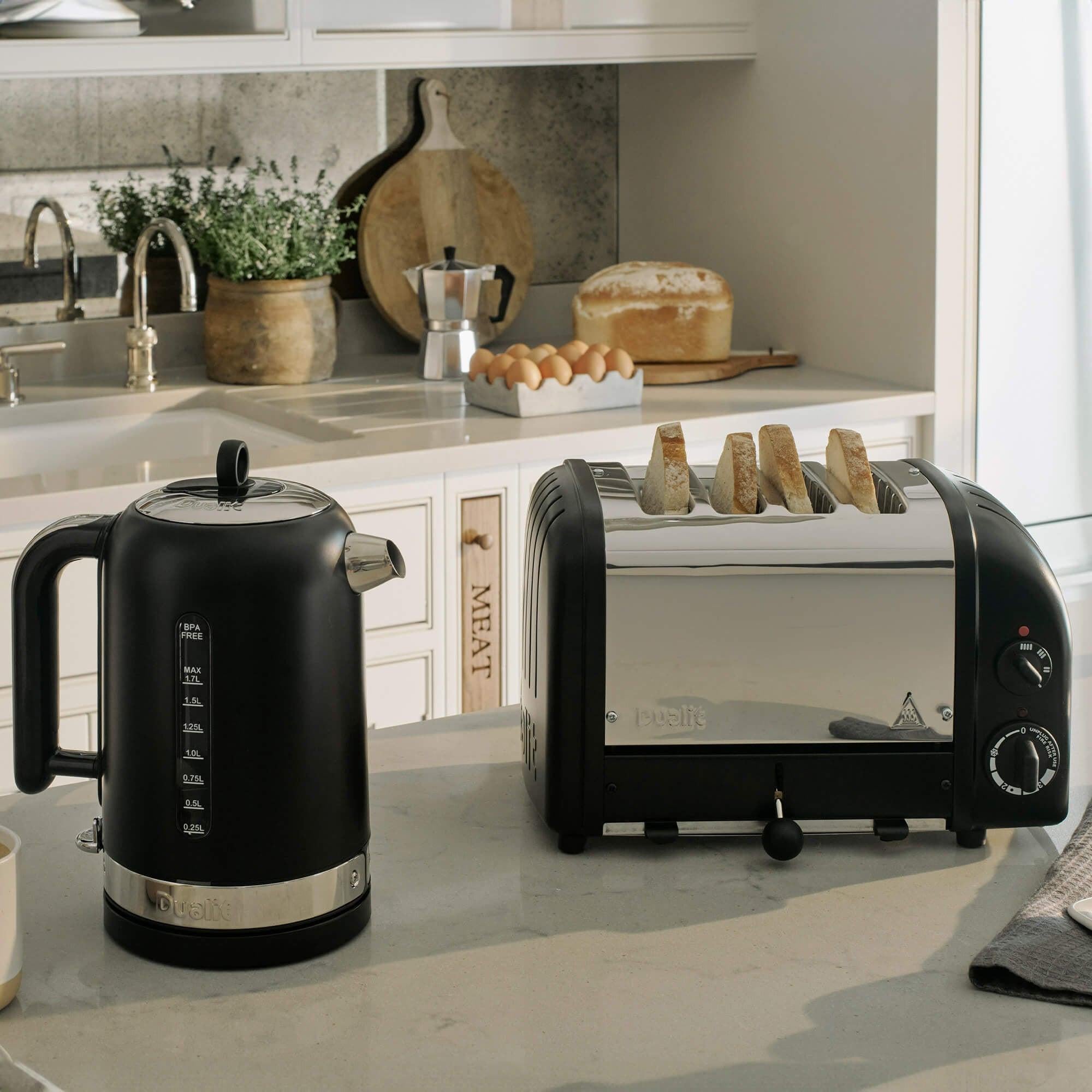 Matte black electric kettle and 4-slice toaster kitchen set on countertop