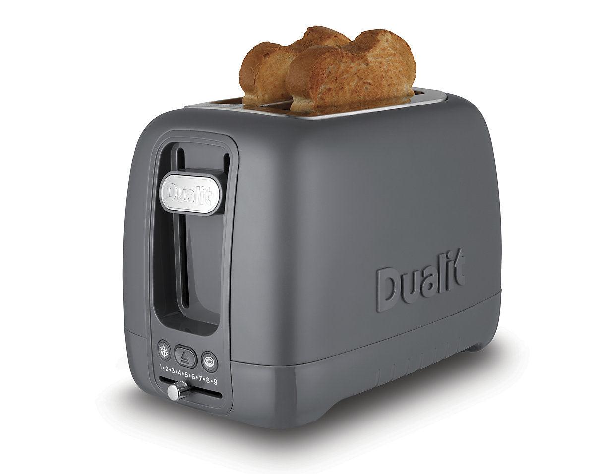 Grey 2-slice toaster with long slots and lever, showing bread centered inside