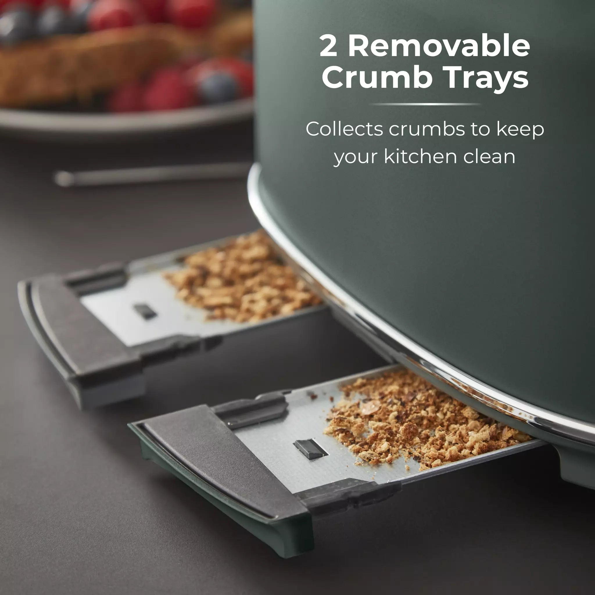 Forest green toaster with two crumb trays extended for easy cleaning