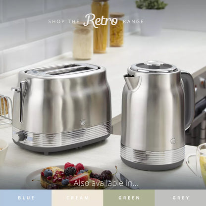Stainless steel retro kettle and 2-slice toaster on countertop, silver finish
