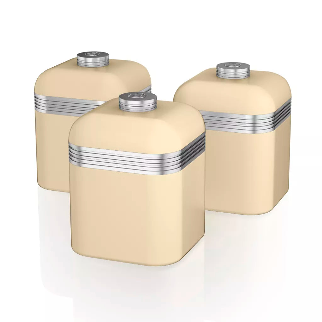 Set of cream kitchen storage canisters with silver striped lids