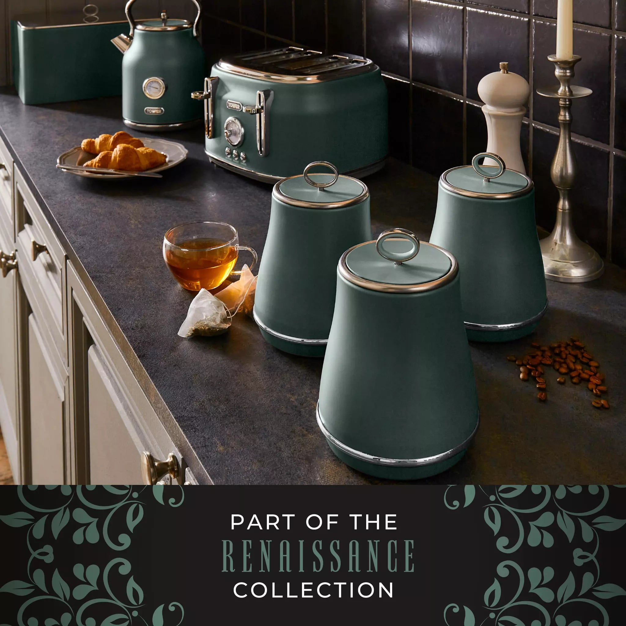 Forest green canisters set on countertop beside a kettle, croissants, and coffee