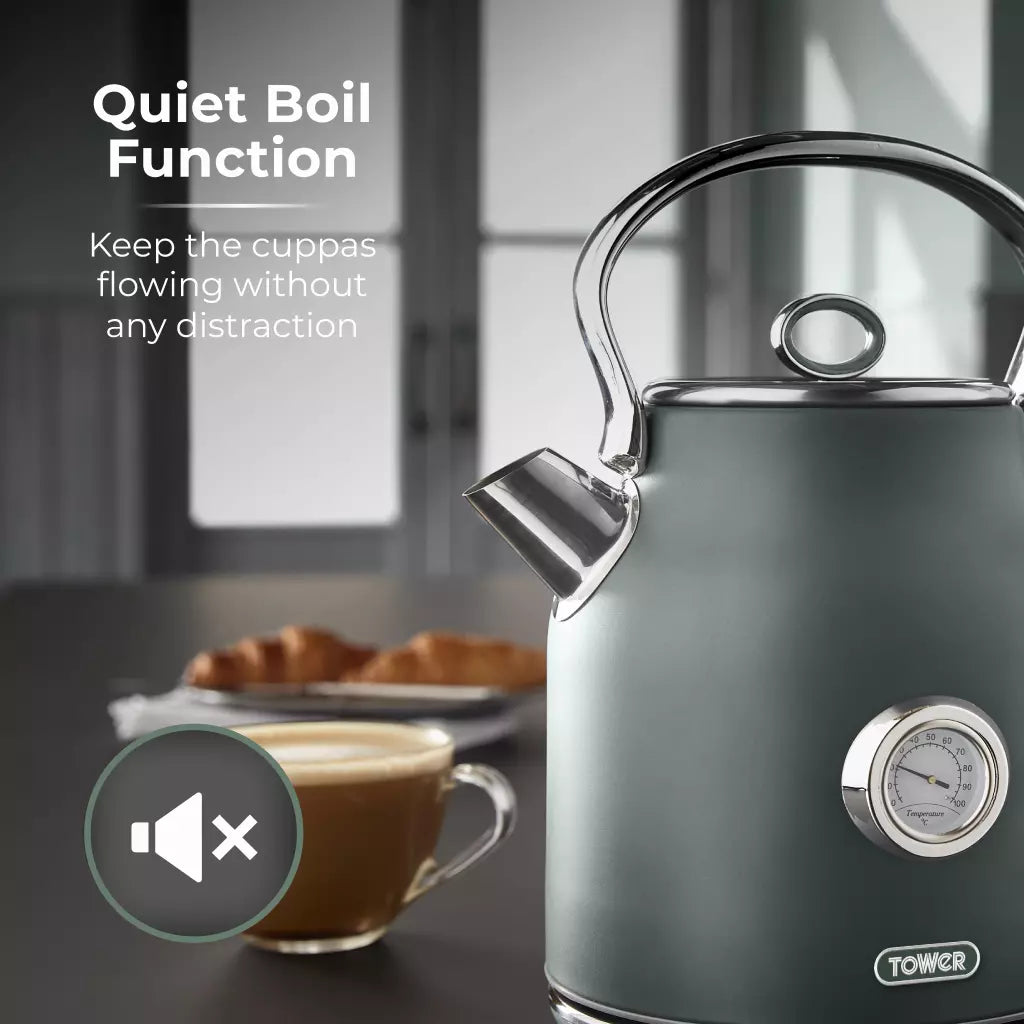Forest green electric kettle with side gauge and pouring spout, steam rising