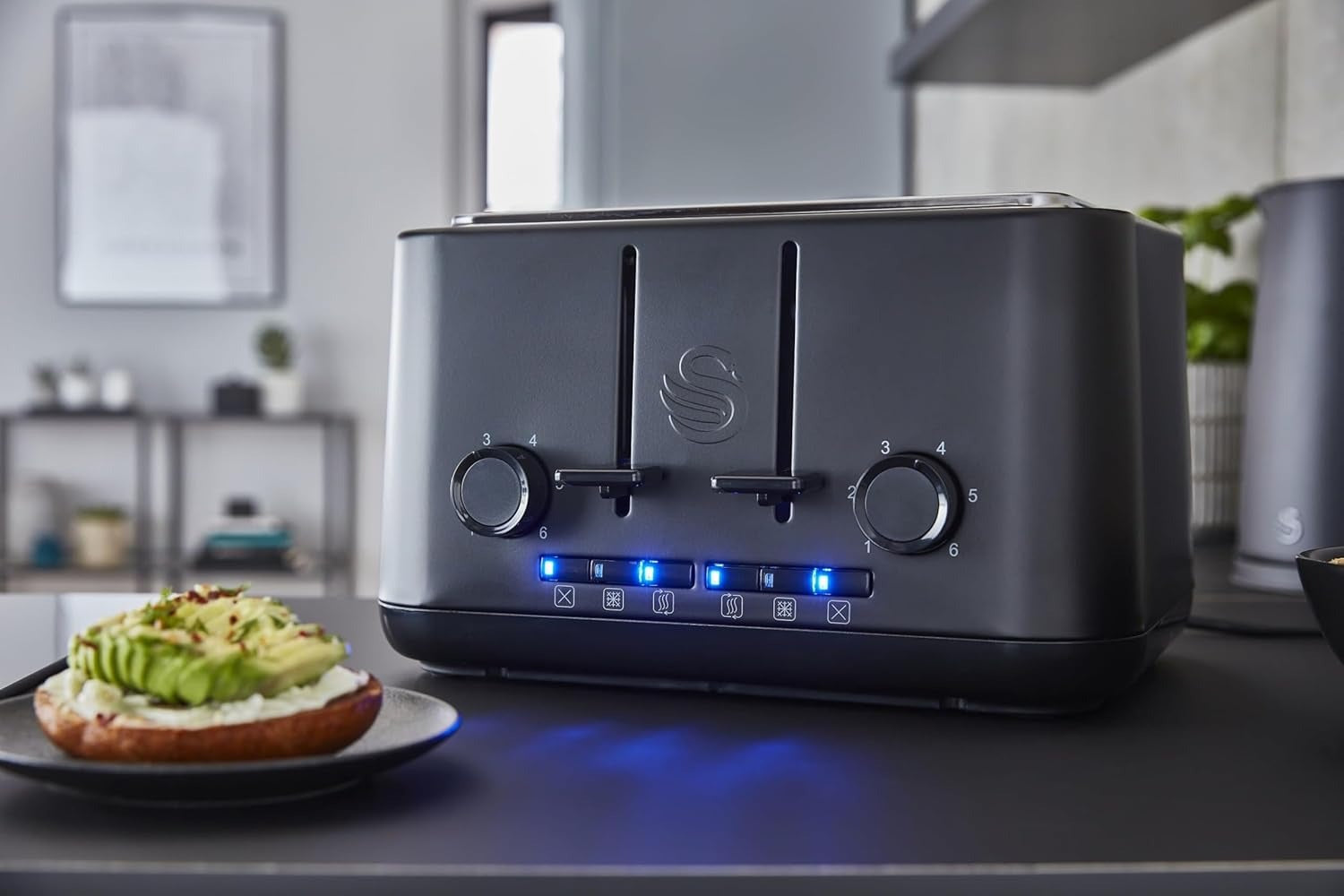 Matt black 4-slice toaster front with illuminated buttons and controls