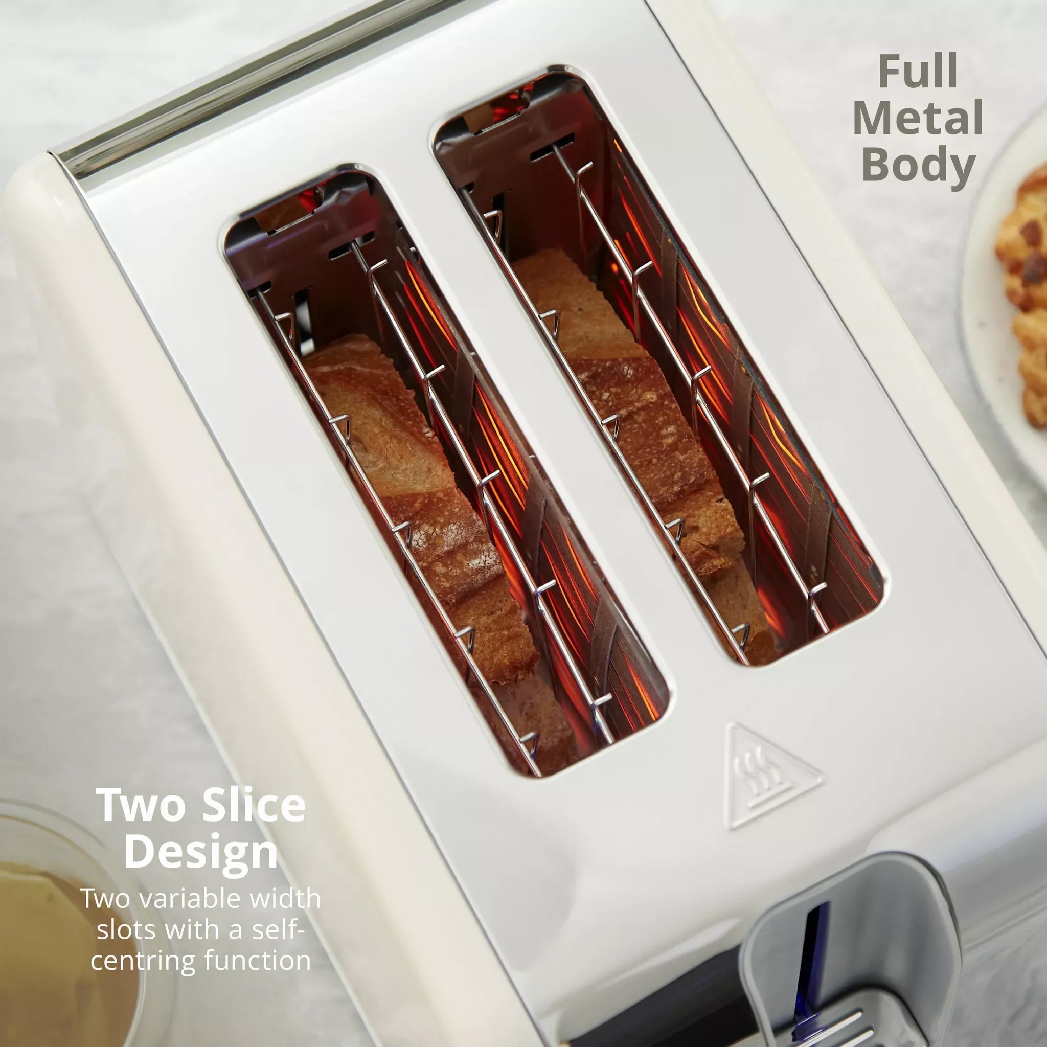 Cream two-slice toaster with wide, self-centring slots and toasting elements visible