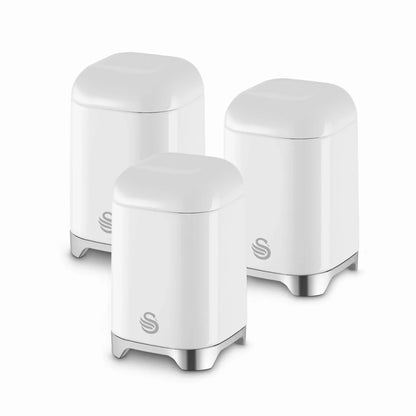 White high-gloss canister storage set with three covered containers, chrome feet