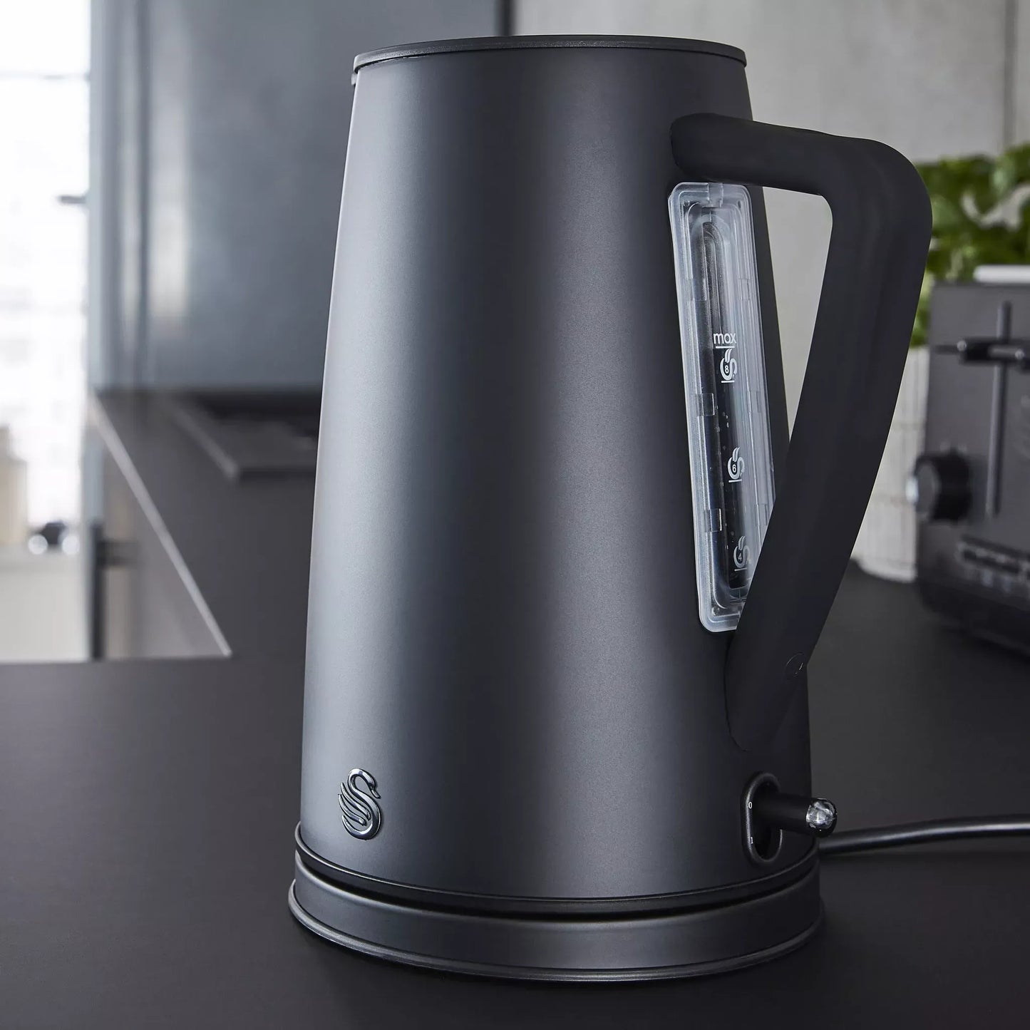 Matt black kettle with clear water level window and power base
