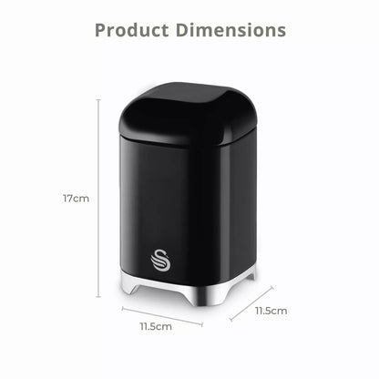 Black canister with glossy finish and white base feet; compact countertop storage