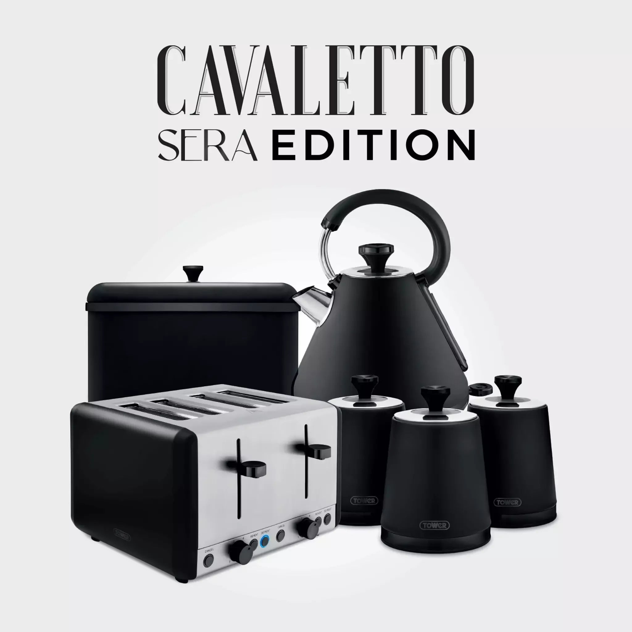 Black bread bin with matching kitchen storage canisters set on countertop