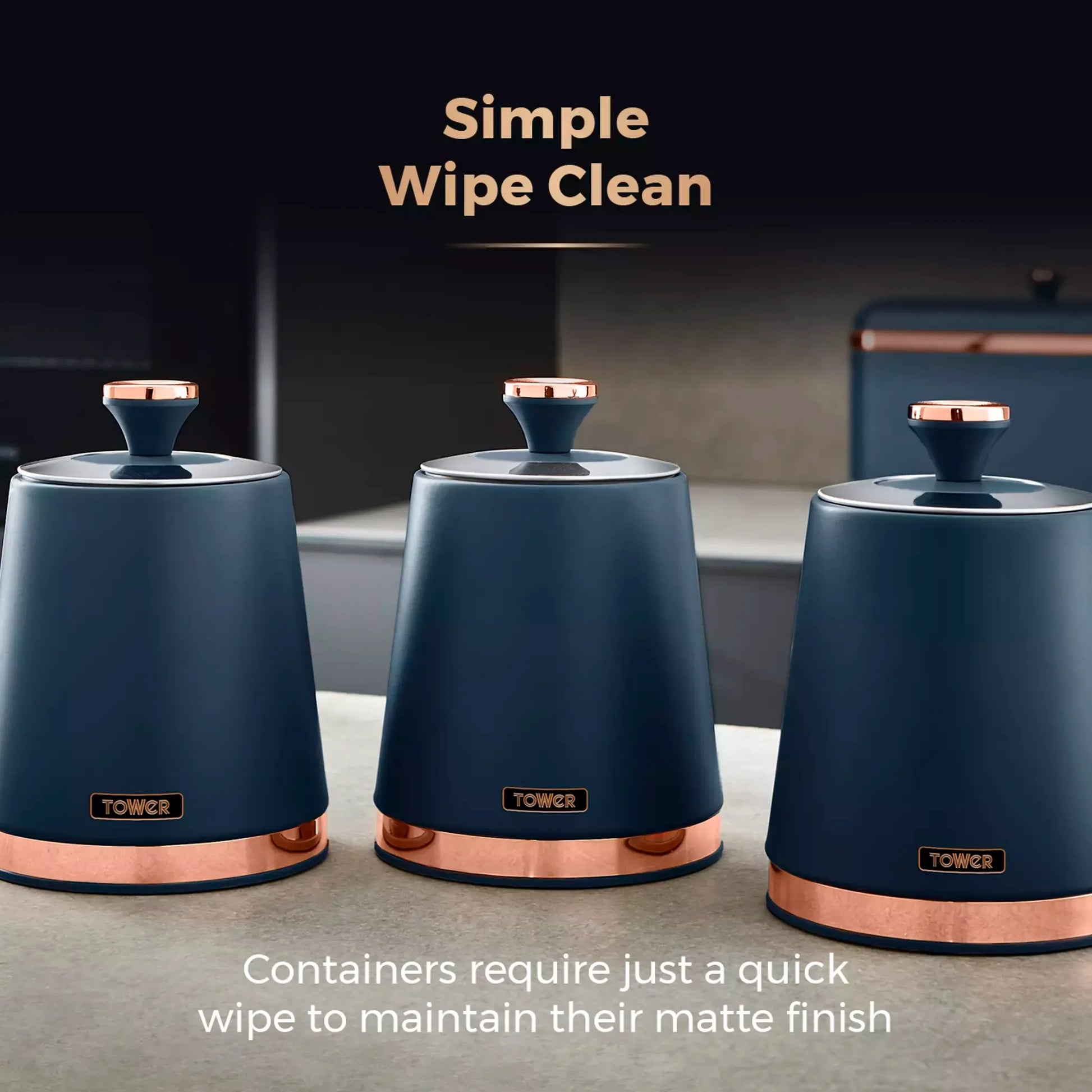 Set of 3 midnight blue storage canisters with rose-gold lids and copper base rings