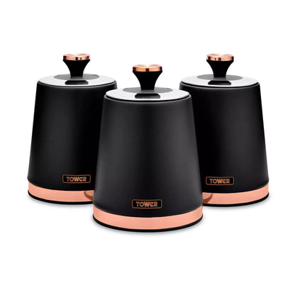 Three black kitchen canisters with rose-gold lid knobs and Tower logos