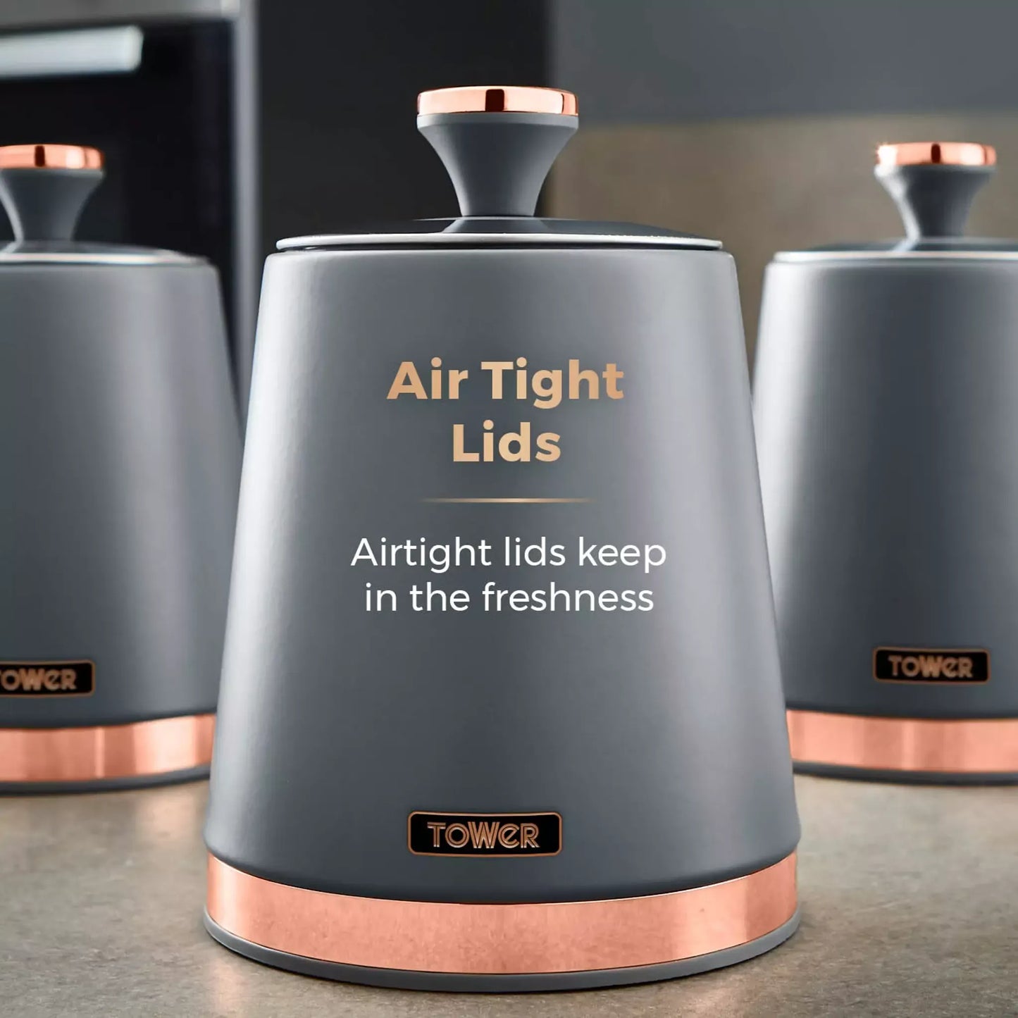 Grey storage container with air-tight lid and copper-tone base, Tower logo