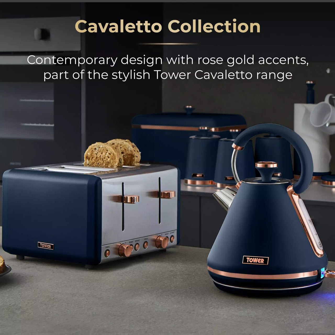 Midnight blue kettle and matching toaster with rose-gold accents in a kitchen set
