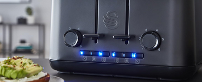 Matt black toaster control panel with illuminated buttons and round temperature dials.