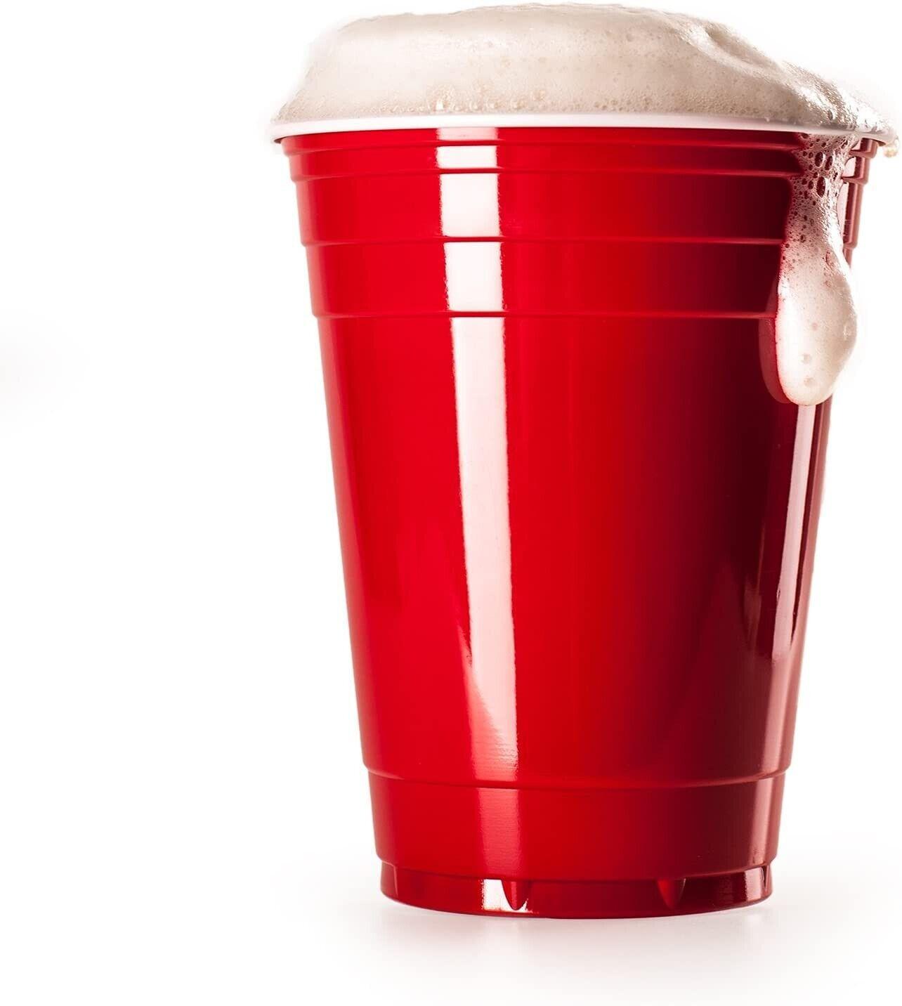 Vivaloo red plastic 16oz party cup with frothy drink on the rim