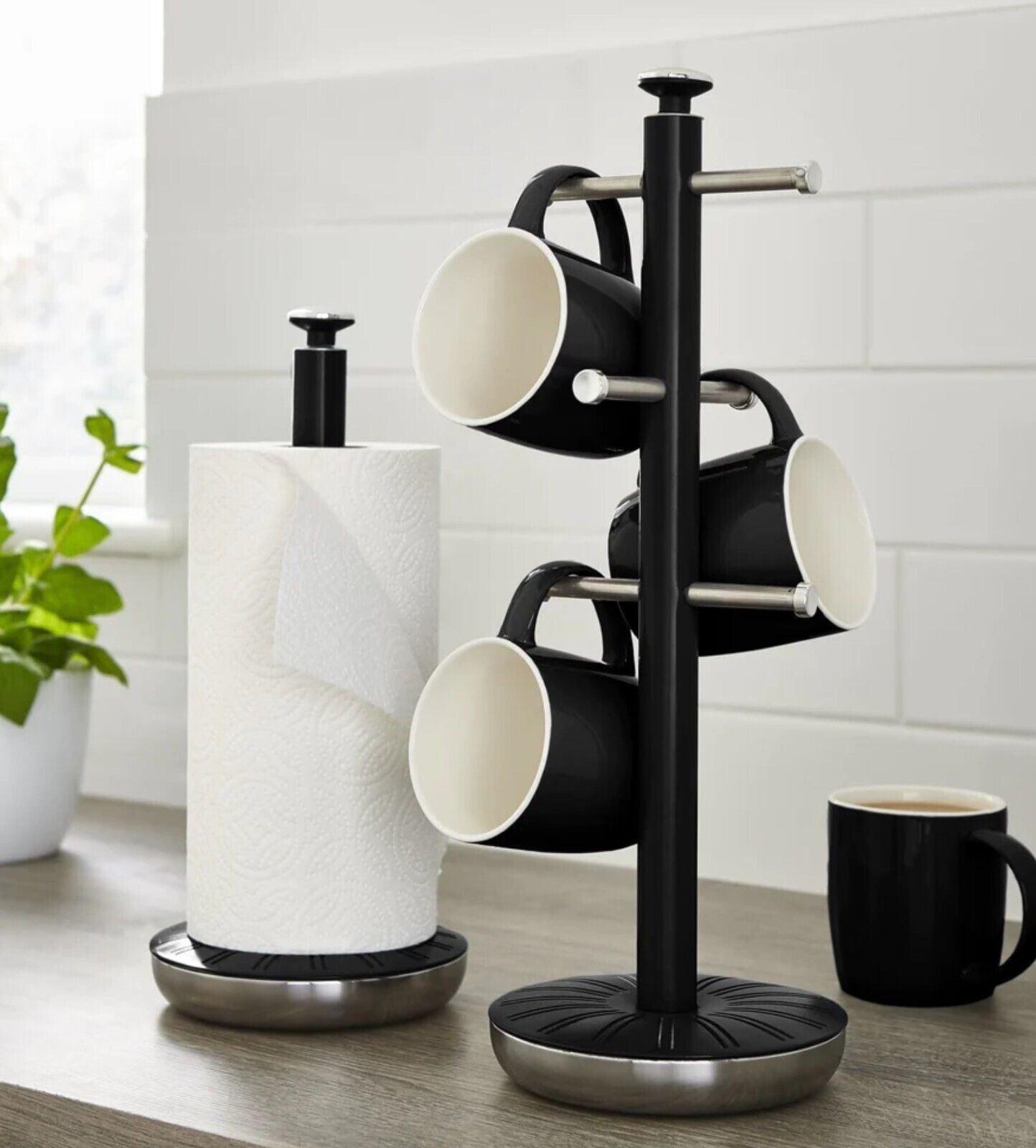 Black mug tree with paper towel holder, three mug hooks, and round base