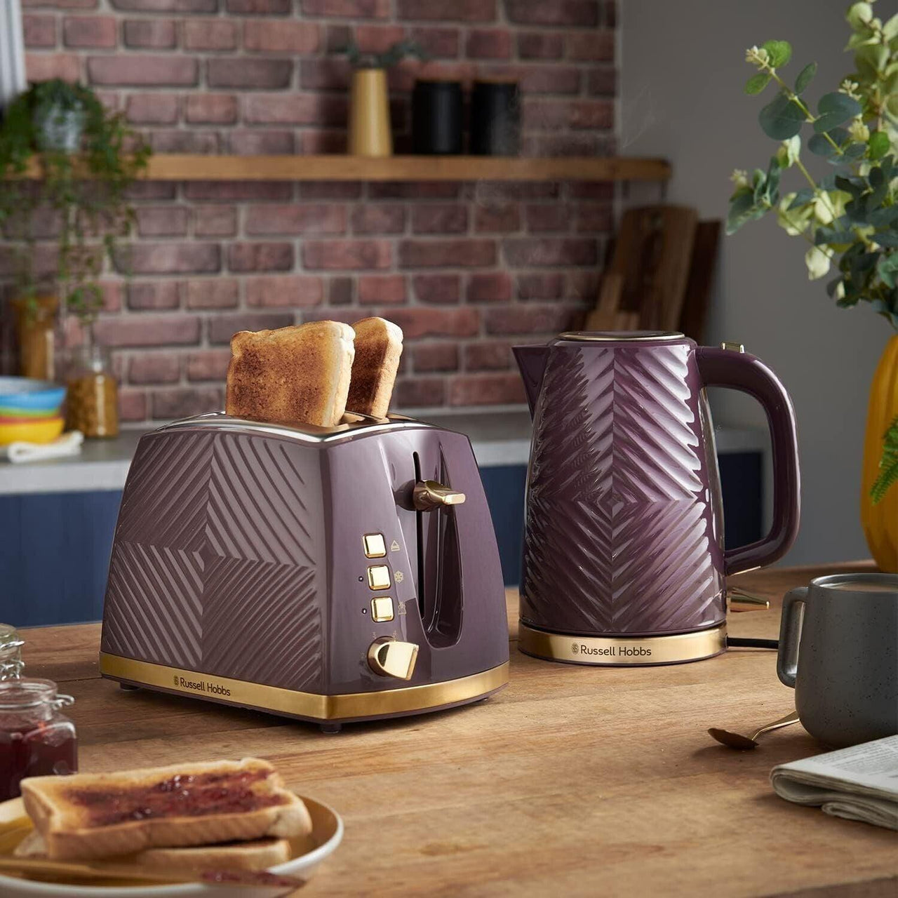 Mulberry 2-slice toaster with gold controls on countertop; toast in slots.